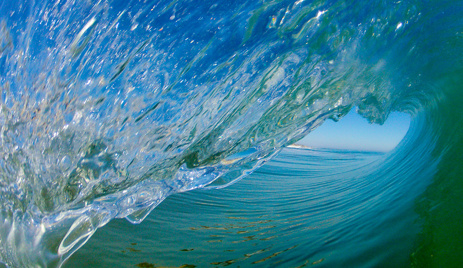 I guess it\'s the normal progression, but shooting from land doesn\'t capture some of the things about surfing I want to capture for others to see. A little Nags Head winter barrel from the right angle.